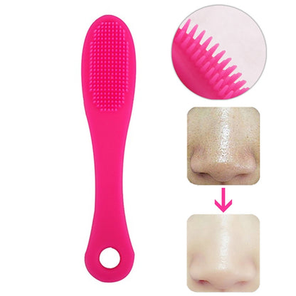 Dark magenta silicone face cleansing brush with dense textured bristles and loop handle