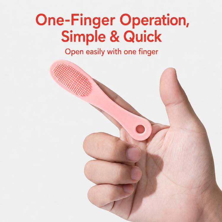 Silicone one-finger face cleansing brush with circular bristle head, pink handle
