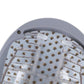 Light gray helmet interior with rows of metal electrodes on white tray