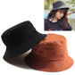 Reversible cotton fisherman hats in black and orange with wide brims
