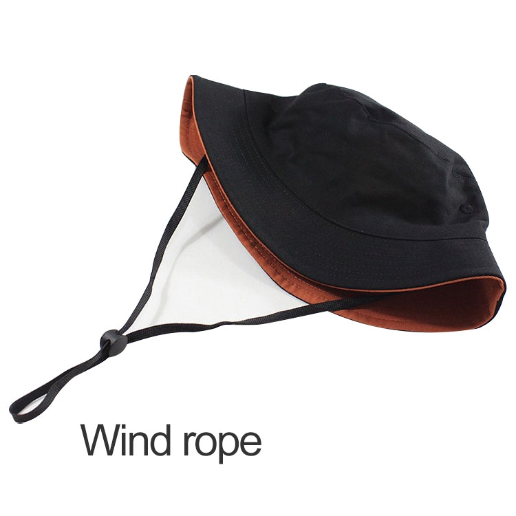 Black and brown reversible fisherman hat with chin tie and wide brim