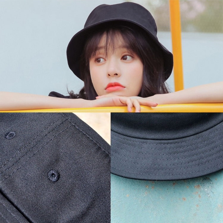 Dark cotton fisherman hat close-up showing stitching and inner brim seam
