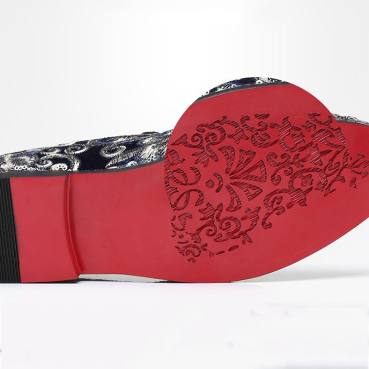 Blue patterned slip-on loafer outsole with red tread and textured finish