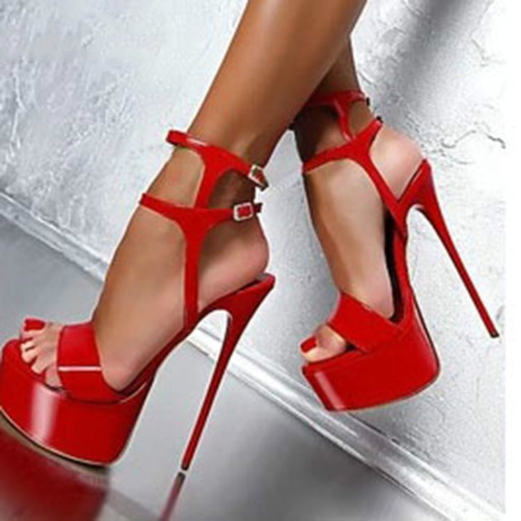 Red platform high-heel sandals with strappy cutouts and ankle strap