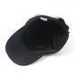 Black baseball cap with wig hair; side view showing inner lining and brim.