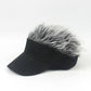 Black baseball cap with gray wavy wig hair on top and curved front visor.