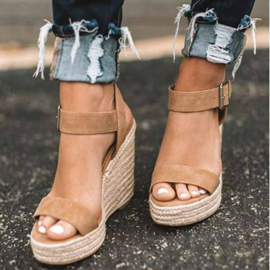 Brown wedge sandals with ankle buckle straps and hemp-rope platform