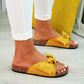 Women’s yellow open-toe slide slippers with knotted bow at the strap