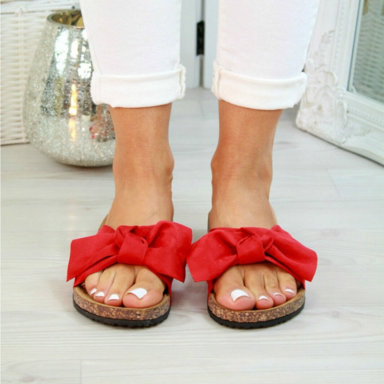 Women red bow slide slippers with open toe and textured cork-style sole