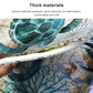 Thick, padded edge of marine-pattern toilet mat with teal-blue sea scene print