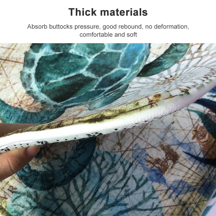 Thick, padded edge of marine-pattern toilet mat with teal-blue sea scene print