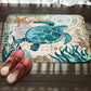 Marine toilet mat with blue sea turtle and whale, starfish accents, non-slip backing