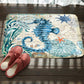 Marine toilet mat with blue whale and starfish, textured seascape print, non-slip