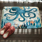 Teal octopus pattern flannel bath mat with non-slip backing, cream base