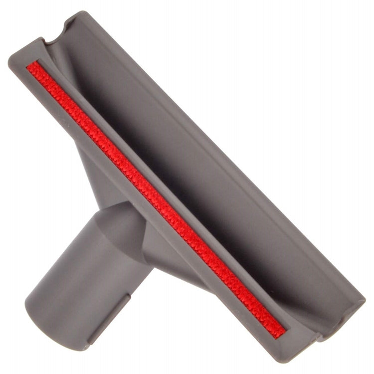 Gray vacuum upholstery brush head with red bristle strip