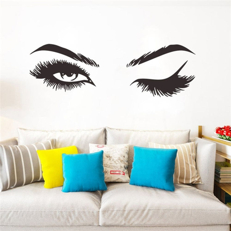 Black eyelash and eyebrow wall decals, two stylized eyes arranged on a wall.