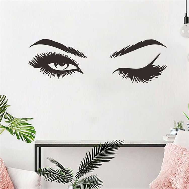 Two black stylized eye decals and eyebrow shapes wall sticker set.