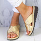 Women’s slip-on slide sandals with open toe, gold straps, and thick rubber-look sole