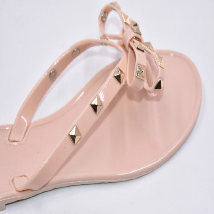 Apricot thong flip-flops with rhinestone-studded bow straps and open toe