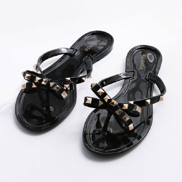 Black rhinestone bow thong flip-flops, slip-on flat sandals with glossy finish