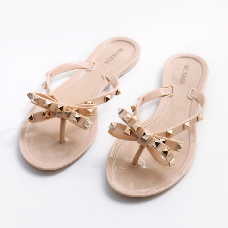 Apricot rhinestone bow thong flip-flops with flat sole and open-toe slip-on design