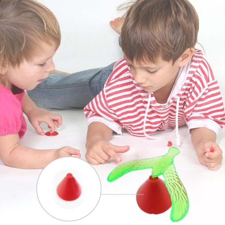 Balancing bird toy with green plastic bird and red weighted base
