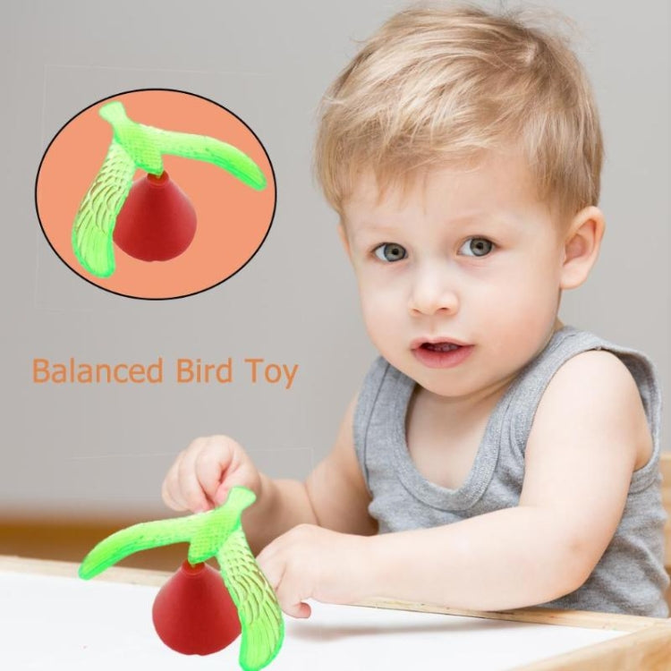 Balancing bird toy, green bird with red weighted bottom