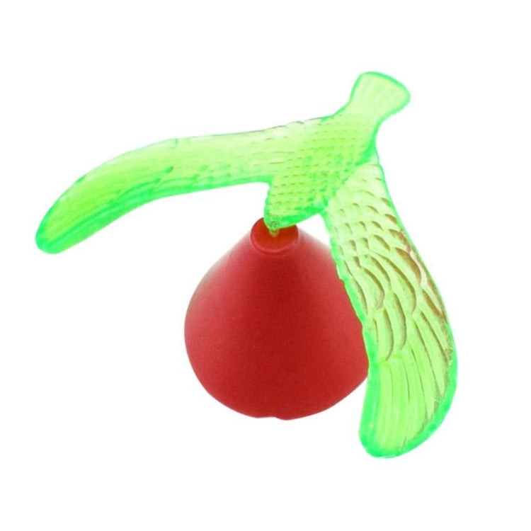Green balancing bird toy with red weighted base