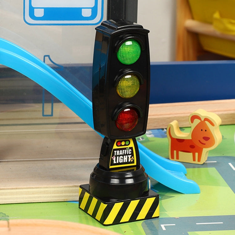 Toy traffic light standing on base with green, yellow, and red LED signals