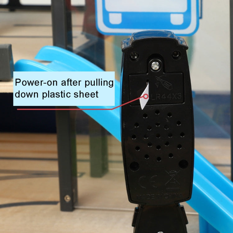 Black toy traffic light rear view with speaker holes and battery/power panel