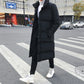 Men's black long puffer down coat with button front and high collar, full body view