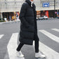 Men's black long puffer down jacket, long length, high collar, button placket detail