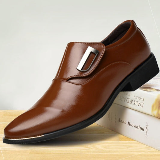 Men's brown slip-on dress shoe with pointed toe and metal buckle strap