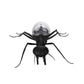 Black ant robot toy with clear dome solar light on rounded body, wide leg stance