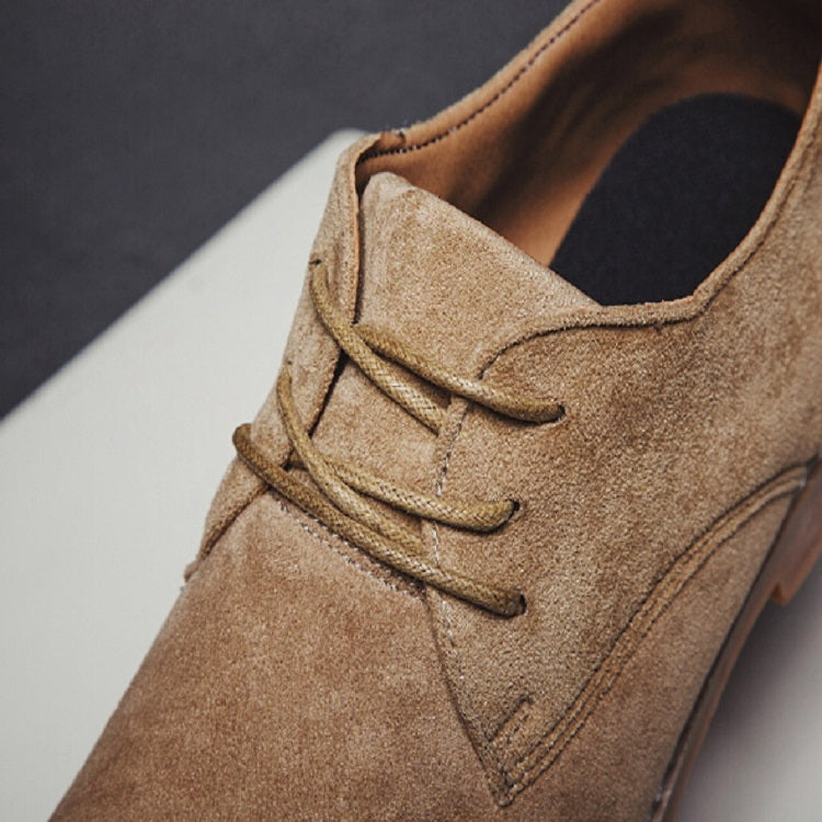 Men's brown suede oxford shoes close-up of lace-up vamp and seam details