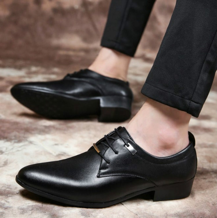 Black pointed-toe lace-up dress shoes worn with cropped pants and low block heel