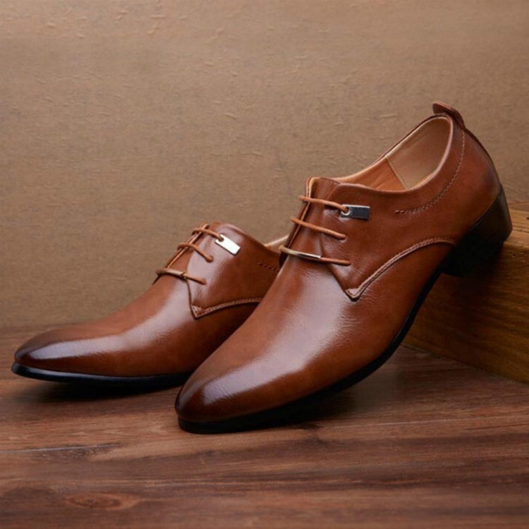 Brown pointed-toe lace-up dress shoes with low block heel and side stitch detailing