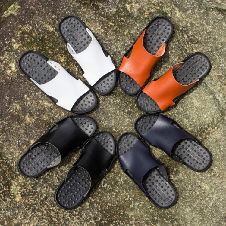 Set of men's slide sandals showing white, orange, black, and blue uppers