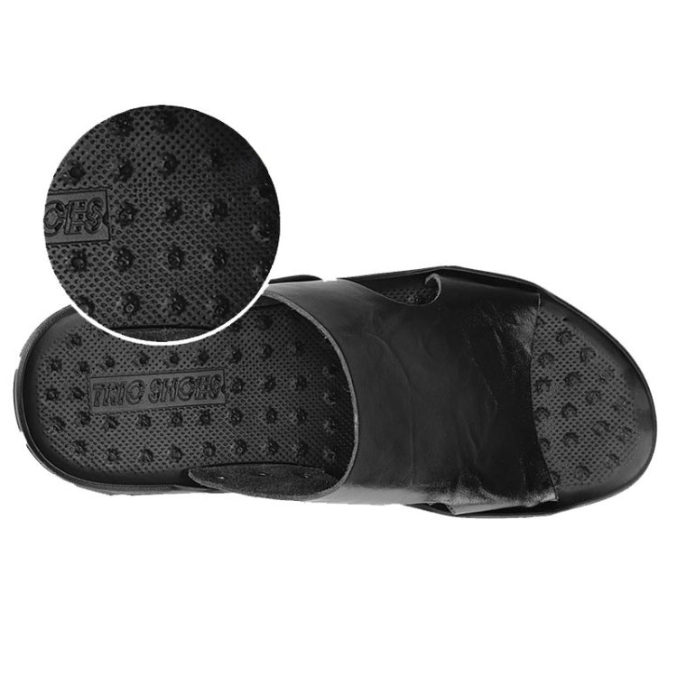 Men's black slide sandals with patterned sole tread and open-toe upper