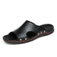 Men’s black microfiber slip-on sandals with round eyelets, orange trim, grippy outsole