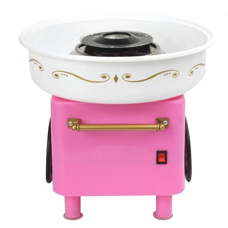 Pink retro cotton candy machine with white bowl, black heater top, and side gold handle.
