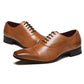Brown leather oxford shoes with lace-up, stitched panels, and black heel