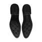 Black rubber outsole of oxford dress shoes, textured tread with star pattern