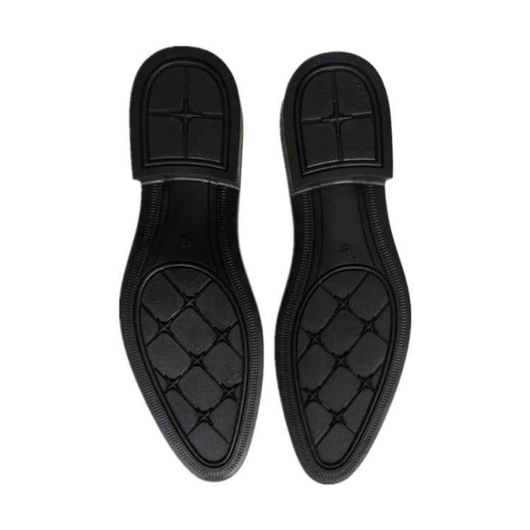 Black rubber outsole of oxford dress shoes, textured tread with star pattern