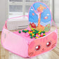 Pink kids play tent with giraffe print, ball pit, and mesh basketball hoop