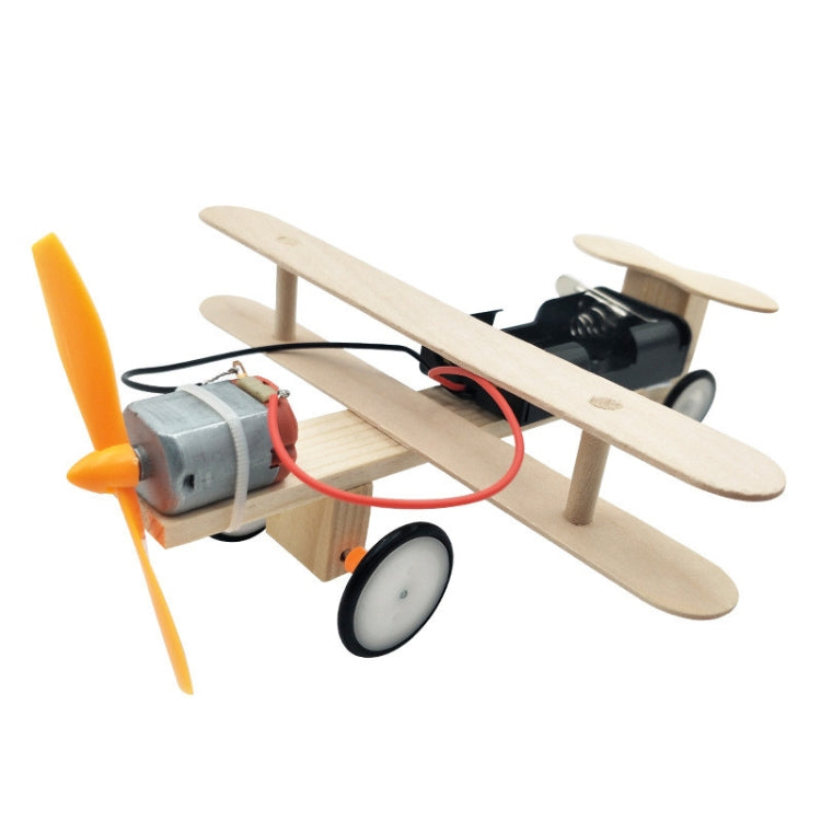 Electric wooden toy airplane model with orange propeller, black motor, and wheels