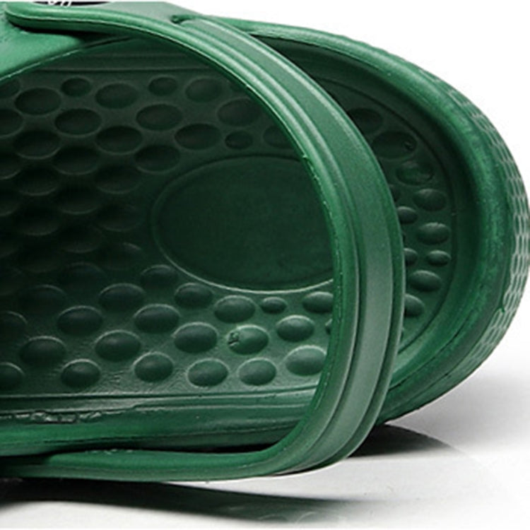 Green medical clog outsole tread close-up with raised non-slip texture