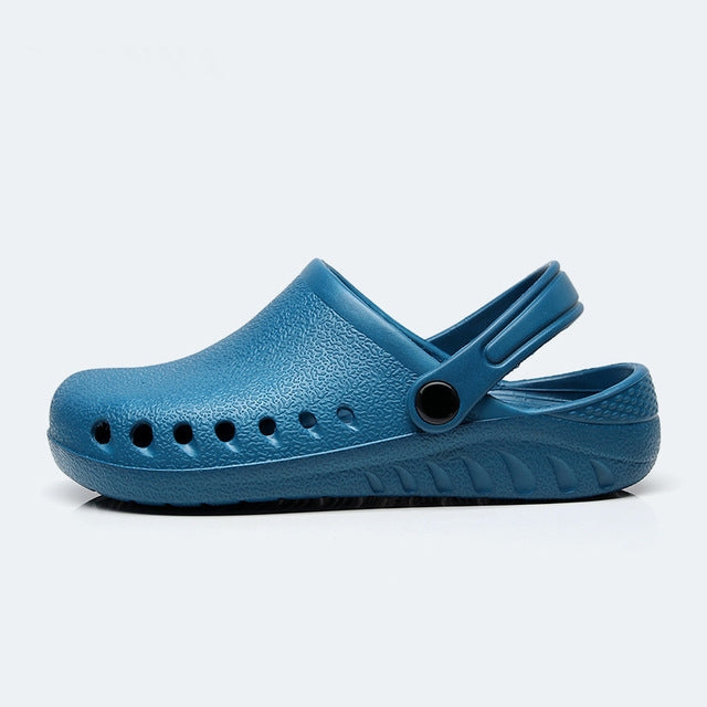 Blue slip-on medical clog with adjustable strap and perforation rows