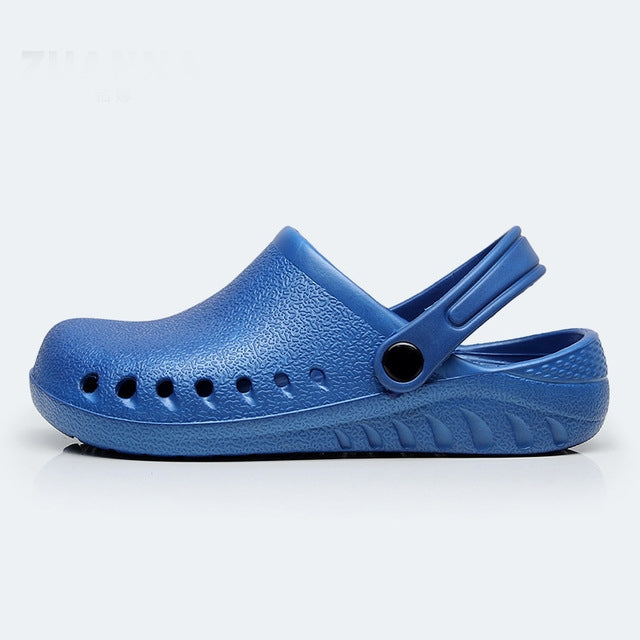 Blue slip-on nursing clog with heel strap and perforated toe, textured upper