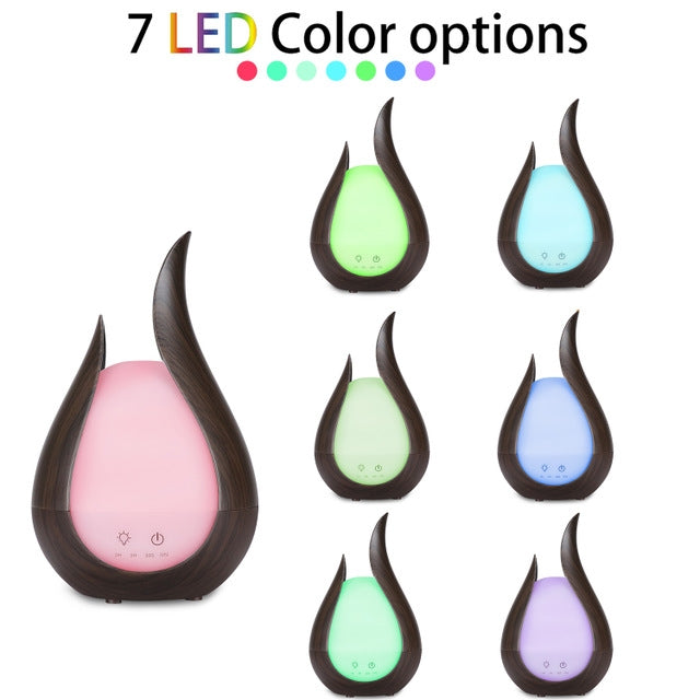 Teardrop aroma diffuser showing seven LED color options in dark housing